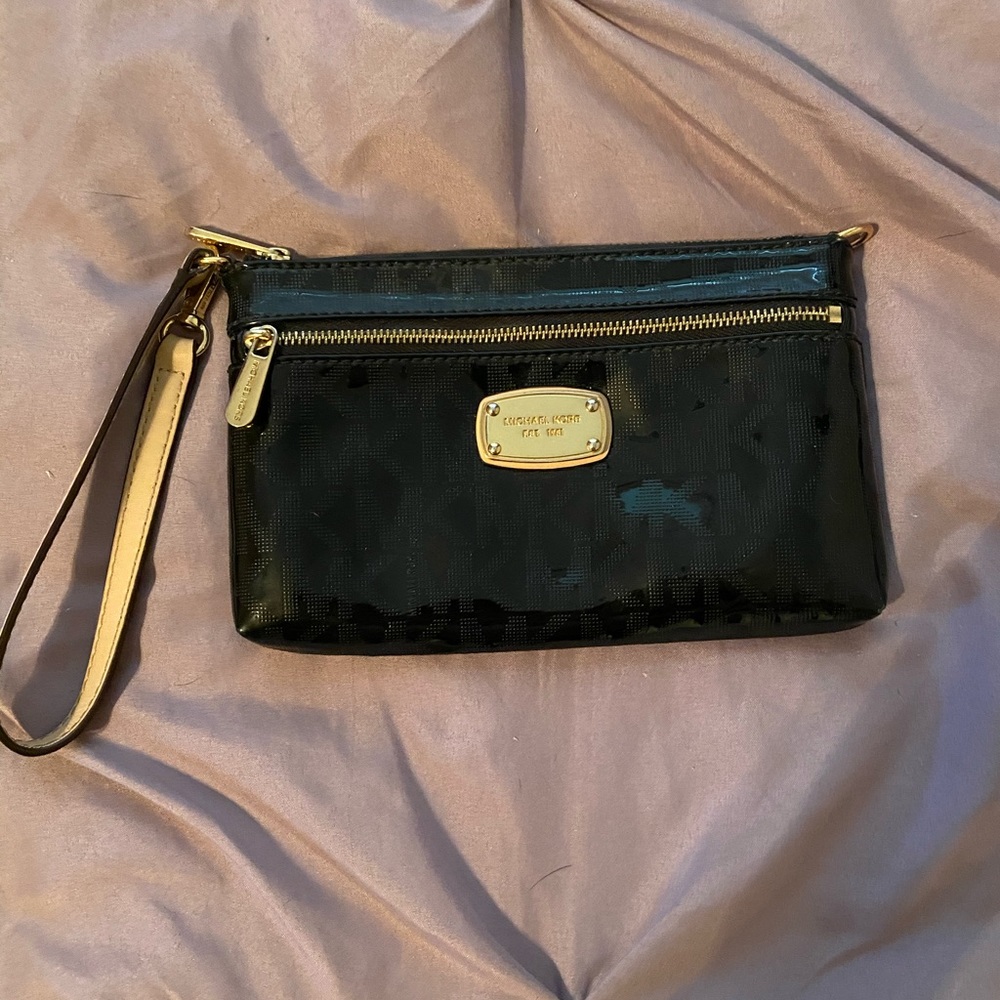 This is a Micheal Kors wristlet. Approx. 6.5x4inch